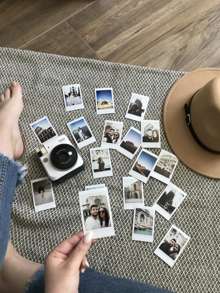 Person Holding An Instant Photo 